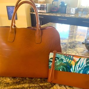 Beautiful brown vegan leather 17”x17” Oceans End bag with matching cosmetic bag.